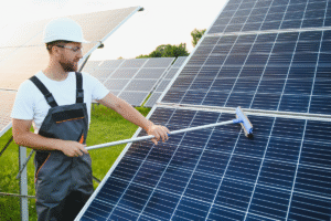 a man cleaning solar panel