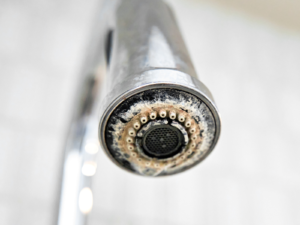 hard water scale on a stainless steel faucet