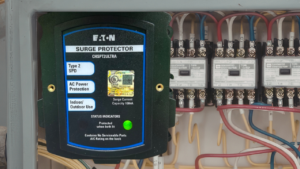whole-home surge protector on an electrical panel